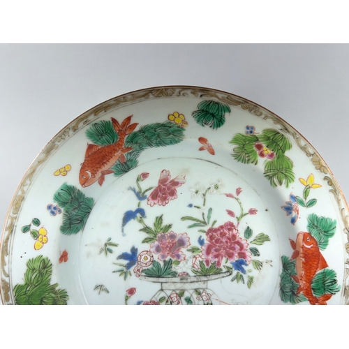5 - A Chinese porcelain Wucai 'Goldfish' plate.Qing dynasty, 18th/19th century. Enamel painted swimming ... 