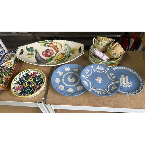 62 - Italian ceramic serving dishes feature hand-painted fruit and floral motifs. Including Wedgwood Blue