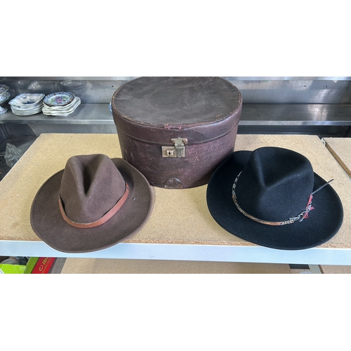 65 - Vintage leather hatbox with lock, featuring vibrant interior lining. Plus two American made Hats