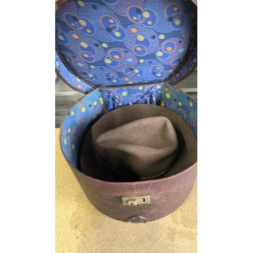 65 - Vintage leather hatbox with lock, featuring vibrant interior lining. Plus two American made Hats