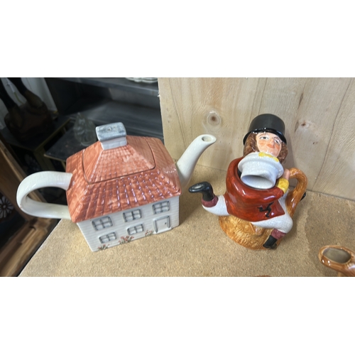 75 - Vintage novelty teapot collection includes cottage and figure designs. Hand-painted ceramic.