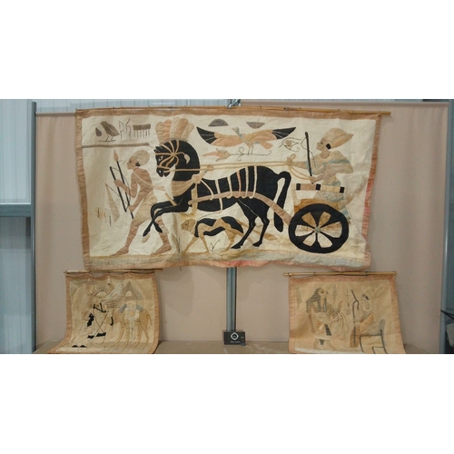 56 - Set of Egyptian-themed textile wall hangings featuring hieroglyphic motifs, chariots, and figures. L... 