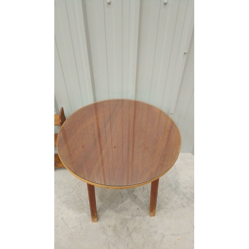 46 - Mid-century wooden circular side table with a polished veneer top and sturdy tapered legs. Structura... 