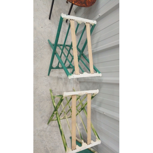 47 - Three vintage folding tables feature faux tortoiseshell, green, and bamboo-style designs.