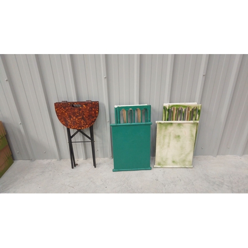 47 - Three vintage folding tables feature faux tortoiseshell, green, and bamboo-style designs.