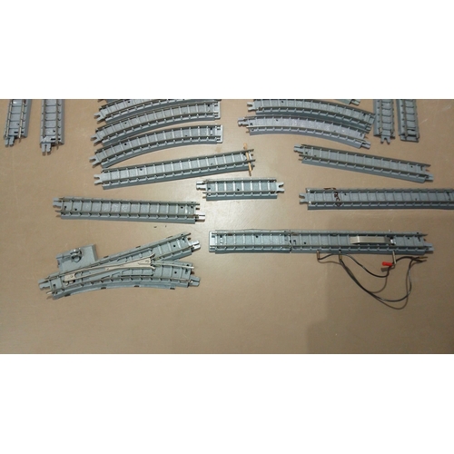 52 - Vintage model railway track collection, including straight and curved sections with connectors and a... 