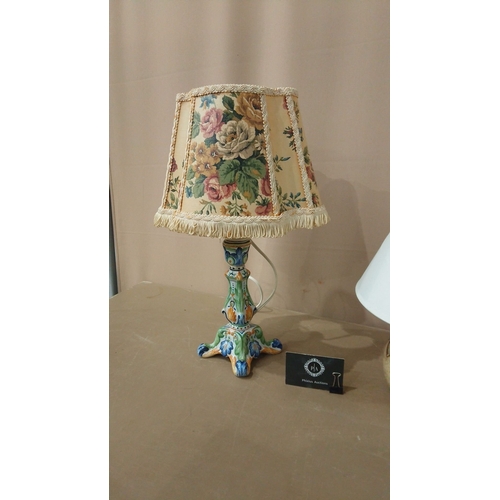 31 - Includes a brass column lamp with a cream shade, a ceramic lamp with a pierced base, and a floral-th... 