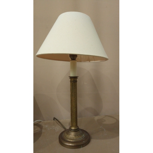 31 - Includes a brass column lamp with a cream shade, a ceramic lamp with a pierced base, and a floral-th... 