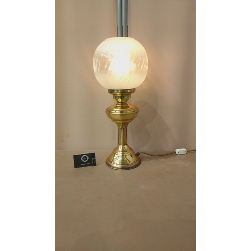 33 - Vintage brass table lamp with frosted glass globe shade, elegant etching details, and classic design... 