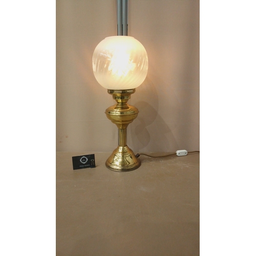 33 - Vintage brass table lamp with frosted glass globe shade, elegant etching details, and classic design... 