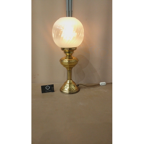 33 - Vintage brass table lamp with frosted glass globe shade, elegant etching details, and classic design... 