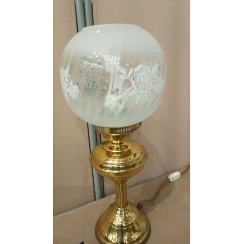 33 - Vintage brass table lamp with frosted glass globe shade, elegant etching details, and classic design... 