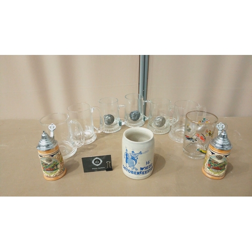 34 - Set of German-themed beer steins and mugs, featuring glass, ceramic, and pewter designs. Includes Ok... 