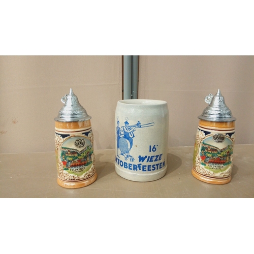 34 - Set of German-themed beer steins and mugs, featuring glass, ceramic, and pewter designs. Includes Ok... 