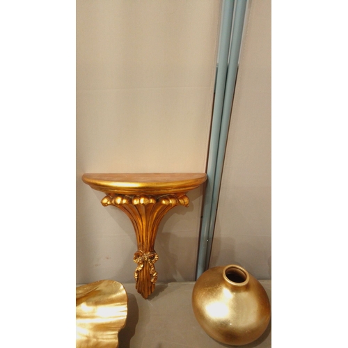 36 - Assorted gilded decor lot features wall shelf, urn, leaf dish, vase, pedestal bowl, and platter. Ele... 