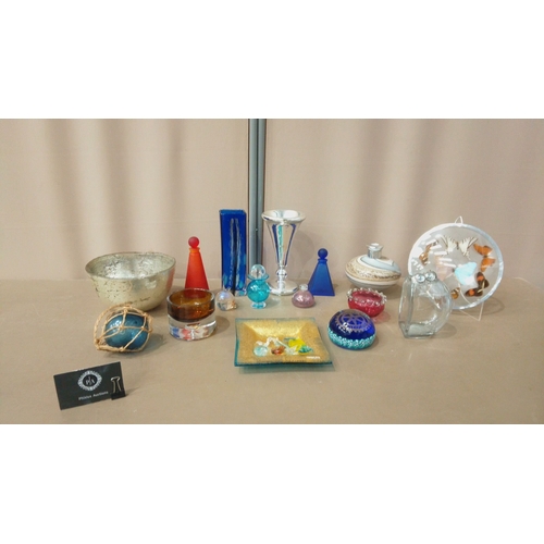 38 - Glassware collection features vibrant art glass vases, decorative bowls, silver accents, and colorfu... 