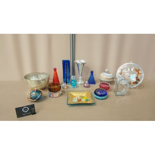 38 - Glassware collection features vibrant art glass vases, decorative bowls, silver accents, and colorfu... 