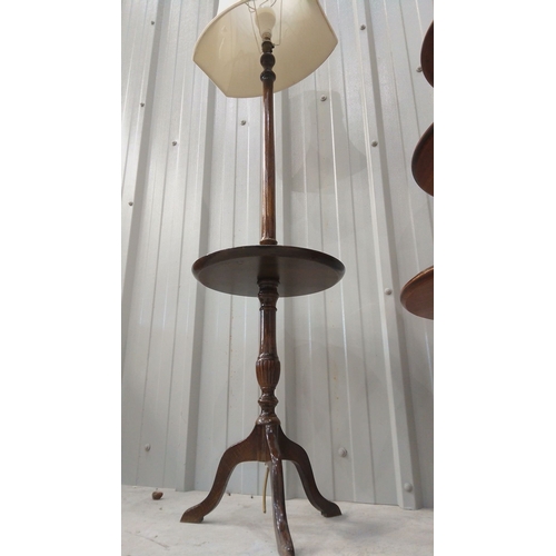 44 - Mid-20th-century walnut floor lamp with integrated circular table, turned pedestal base, and origina... 