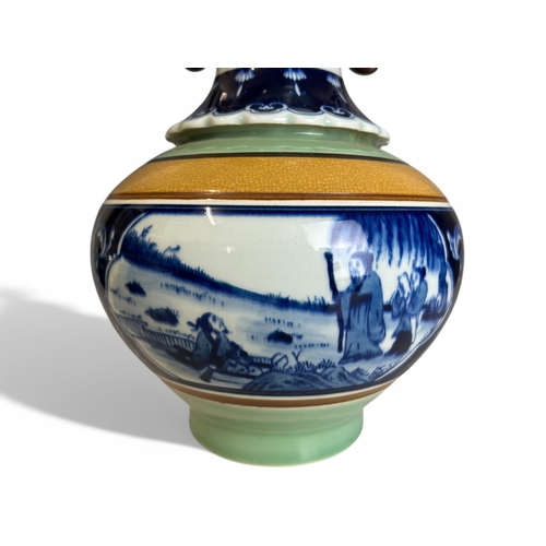 25 - A large Chinese porcelain vase.Celadon ground with central painted panel depicting fenced garden sce... 
