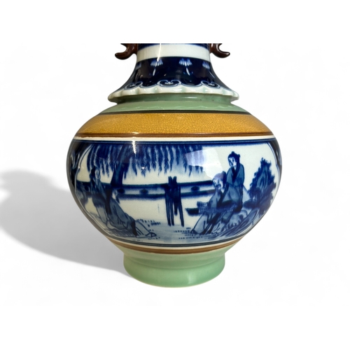 25 - A large Chinese porcelain vase.Celadon ground with central painted panel depicting fenced garden sce... 