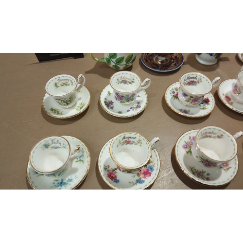 105 - Set of Monthly Floral Bone China Teacups and Saucers: Beautifully adorned Royal Albert designs for e... 