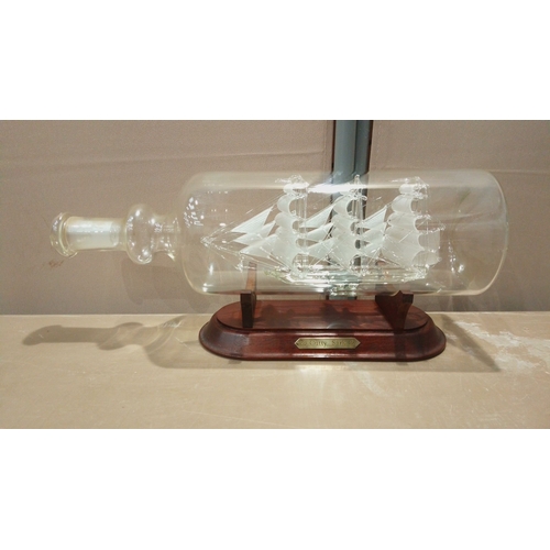 106 - Glass ship-in-a-bottle model of the 