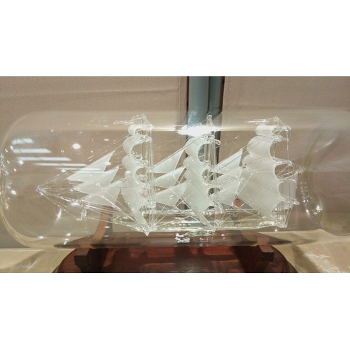 106 - Glass ship-in-a-bottle model of the 