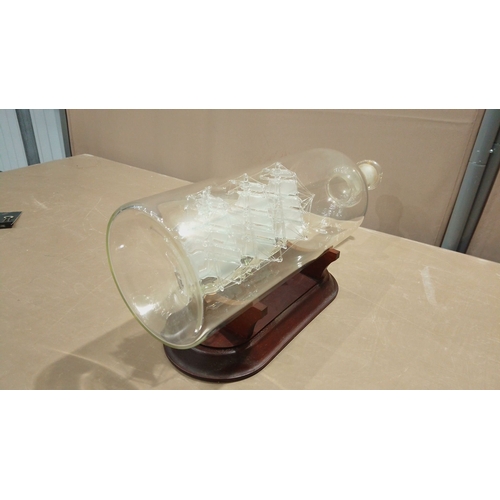 106 - Glass ship-in-a-bottle model of the 