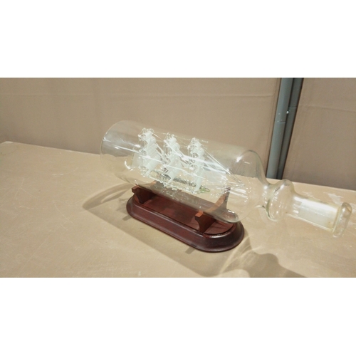 106 - Glass ship-in-a-bottle model of the 