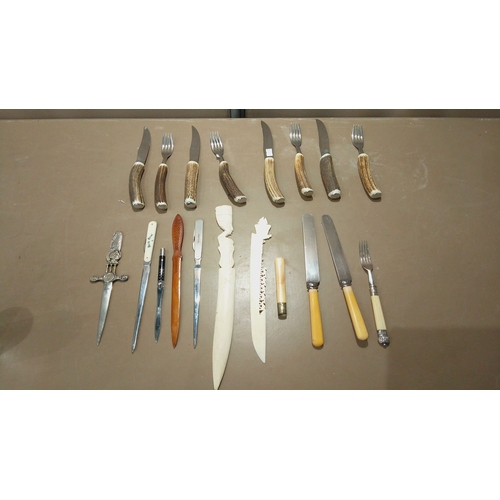 111 - Set of antler-handled steak knives and forks, paired with vintage letter openers, including carved w... 