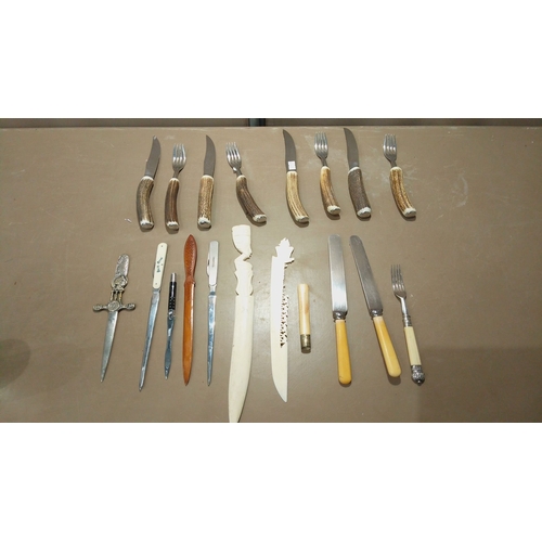 111 - Set of antler-handled steak knives and forks, paired with vintage letter openers, including carved w... 