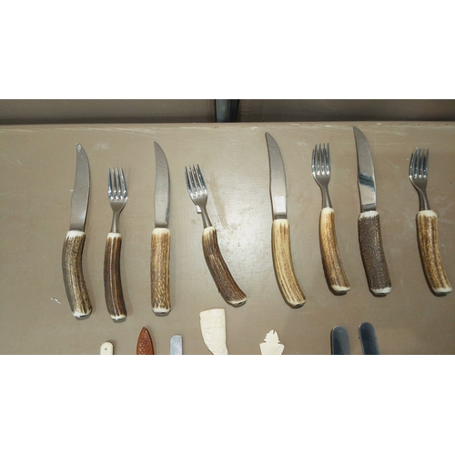 111 - Set of antler-handled steak knives and forks, paired with vintage letter openers, including carved w... 