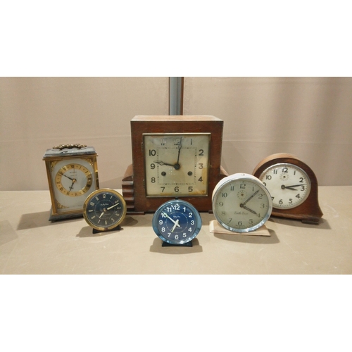 120 - A Large Lot of vintage mantel clocks: an Art Deco wood-cased clock with chiming movement, plus a sma... 