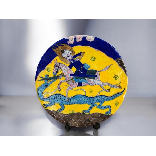 30 - Indian Iznik style hand painted plate.Depicting warrior on horseback pursuing a Dragon.Diameter - 26... 