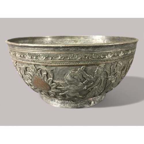 84 - 19th Century Persian Silvered Copper Bowl with Hunter and Mythical Beast Relief Decoration.