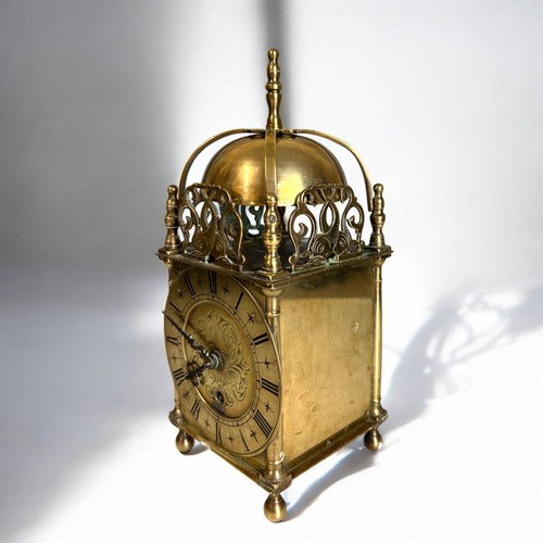 203 - An early 20th Century Brass lantern clock. Height - 25cm