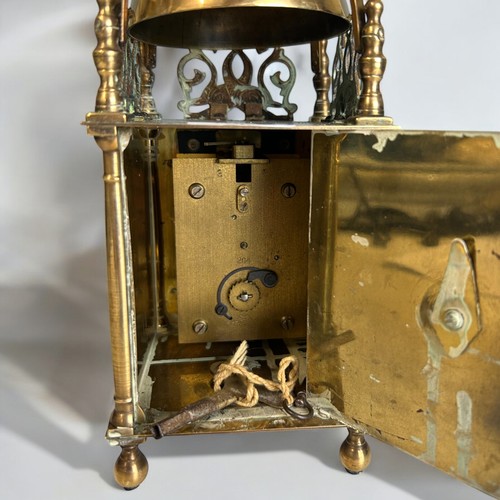 203 - An early 20th Century Brass lantern clock. Height - 25cm