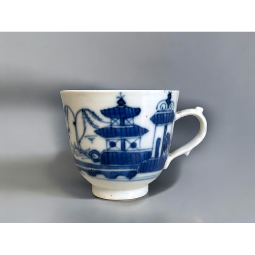 34 - An 18th Century Chinese export blue & white porcelain tea cup.'Two Pagoda's' design, with scroll... 