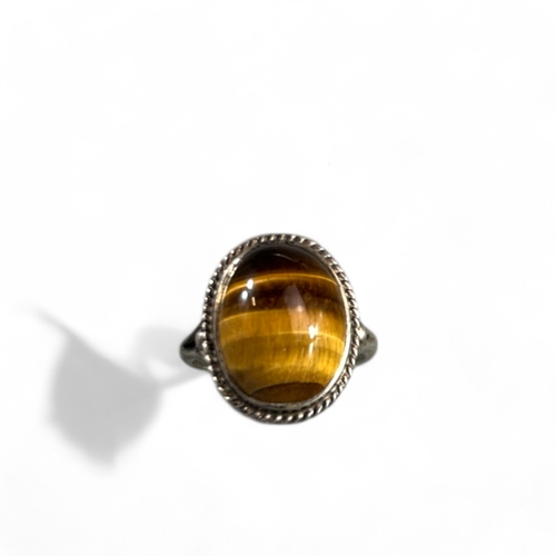 362 - A Sterling silver and large Tiger's eye ring.Size -  N/O