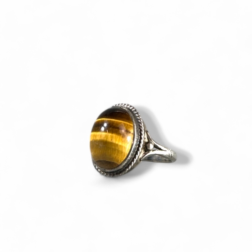 362 - A Sterling silver and large Tiger's eye ring.Size -  N/O