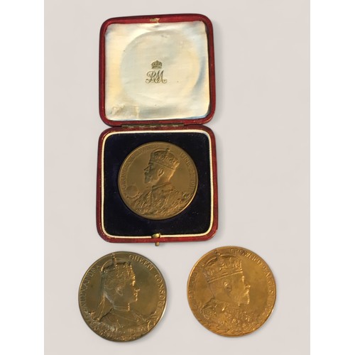 223 - A cased bronze official George V coronation medal.Together with two bronze Edward VII coronation med... 