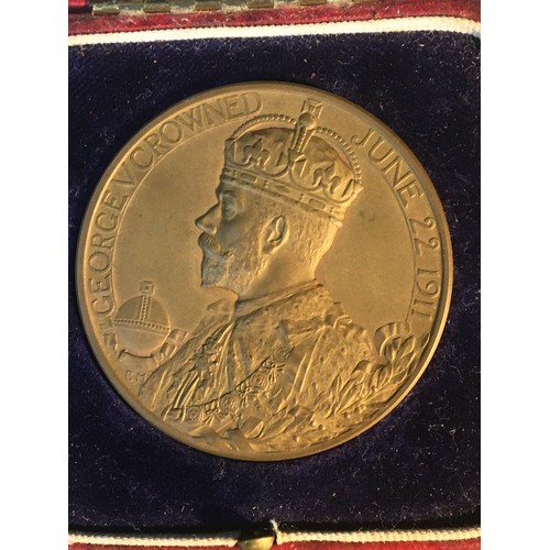 223 - A cased bronze official George V coronation medal.Together with two bronze Edward VII coronation med... 