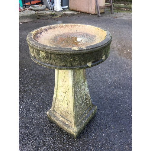 405 - Attractive and well weathered reconstituted Stone Bird Bath with Vine and Bird Decoration.H 63cm.... 