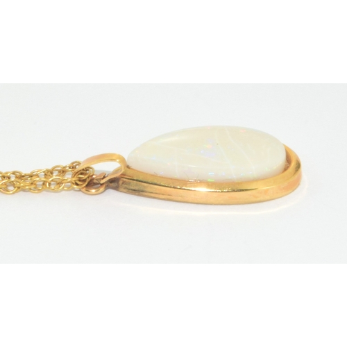 103 - Large 9ct gold opal tear drop pendant necklace on a 44cm 9ct gold chain