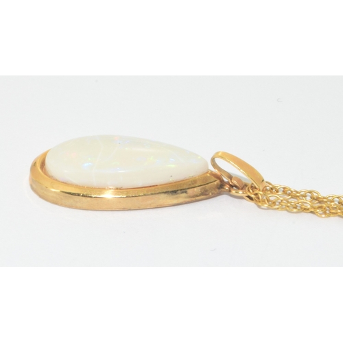 103 - Large 9ct gold opal tear drop pendant necklace on a 44cm 9ct gold chain