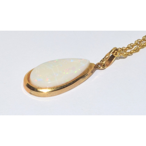 103 - Large 9ct gold opal tear drop pendant necklace on a 44cm 9ct gold chain