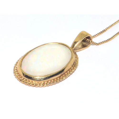 123 - 9ct gold vintage Opal pendant necklace in a scroll work setting on a 39cm 9ct gold chain 