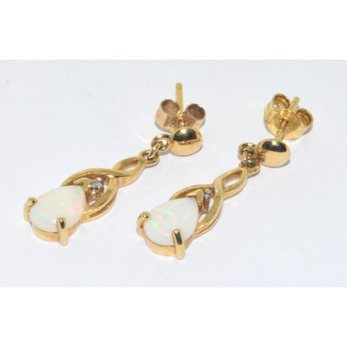 143 - 9ct gold Opal drop stud earrings 