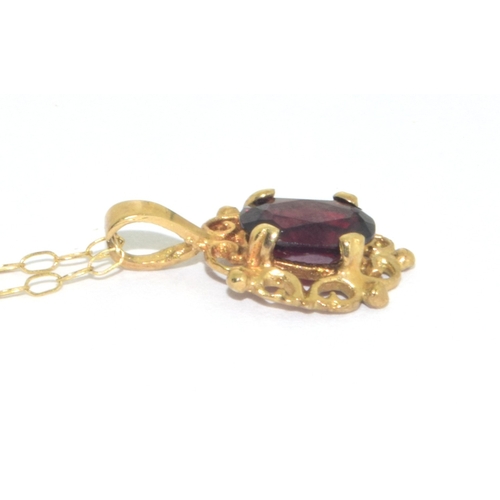 73 - 9ct gold antique garnet and earring suite of jewellery set in a scroll open work design on a 44cm 9c... 