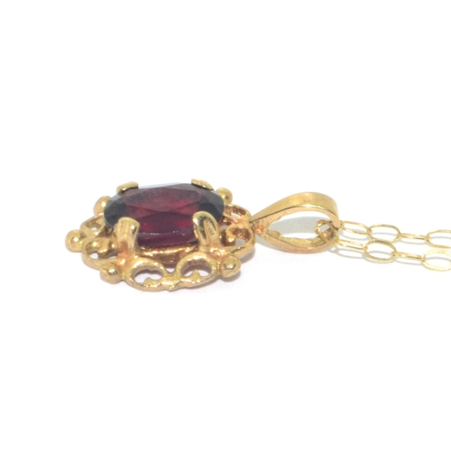 73 - 9ct gold antique garnet and earring suite of jewellery set in a scroll open work design on a 44cm 9c... 